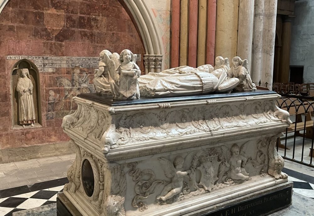 Ornate tomb chest with effigies of 2 young children supported by angels