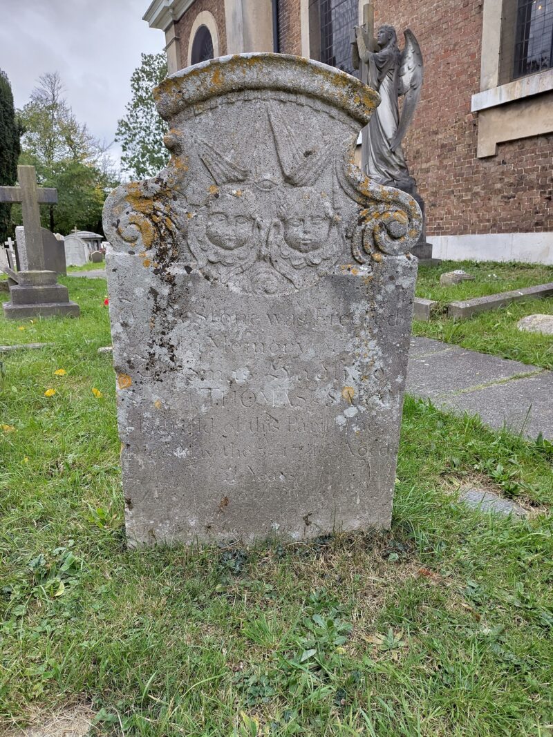 Tombstone with cherubs and eye