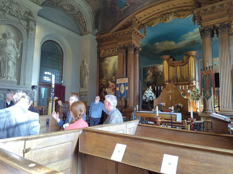 Group tour of Baroque church with fictive sculpture, wall paintings and elaborately carved organ