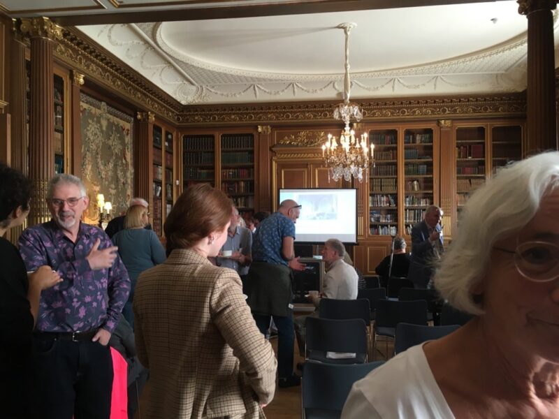 Group of people in hall of West Dean College