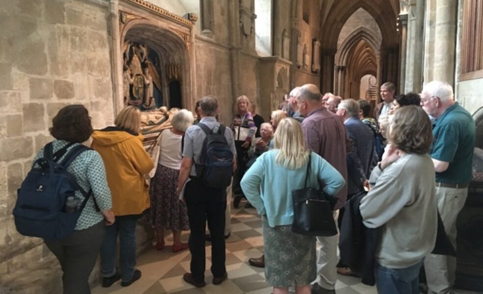 Group of people looking at a tomb Group of people looking at a tomb