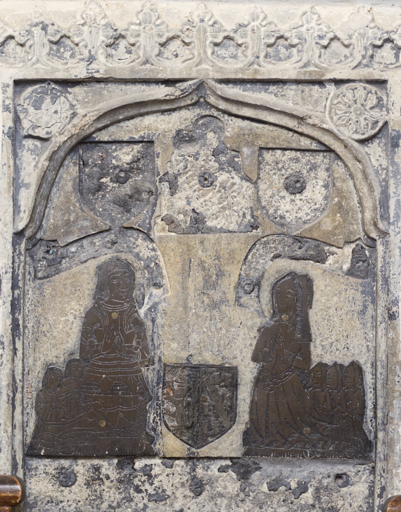 Monumental brass with kneeling couple in early sixteenth-century costume