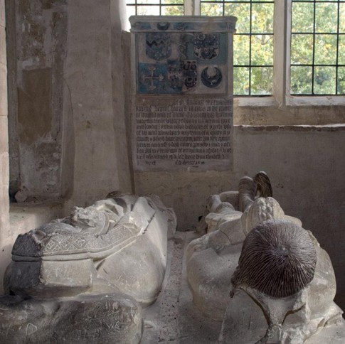 effigy viewed from above, with window below feet
