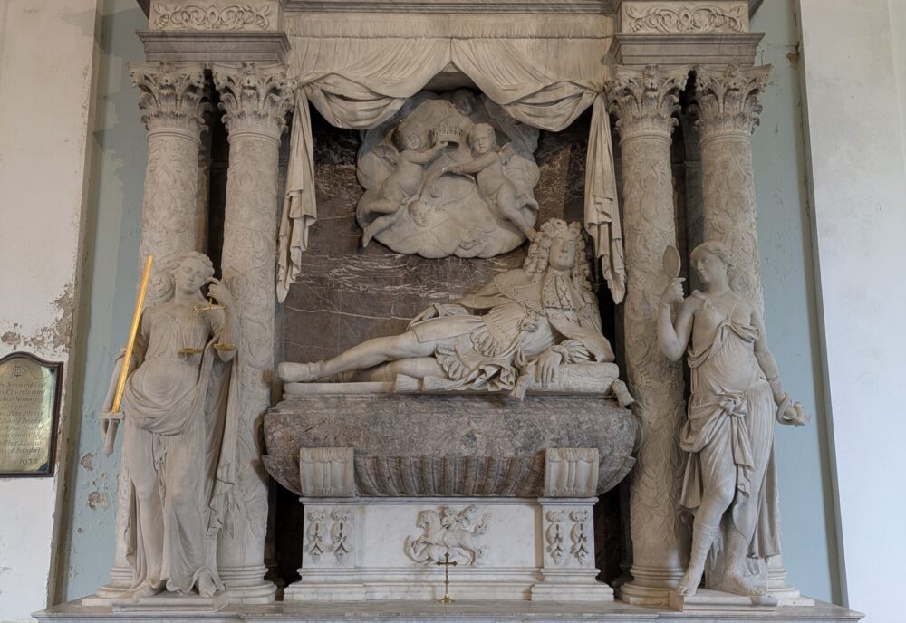 Reclining figure in semi-Roman costume, flanked by classical virtues and surmounted by putti Reclining figure in semi-Roman costume, flanked by classical virtues and surmounted by putti