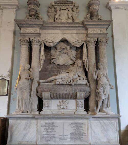 Reclining figure in semi-Roman costume, flanked by classical virtues and surmounted by putti