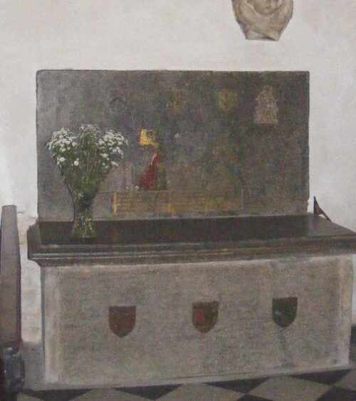 Monumental brass above tomb chest