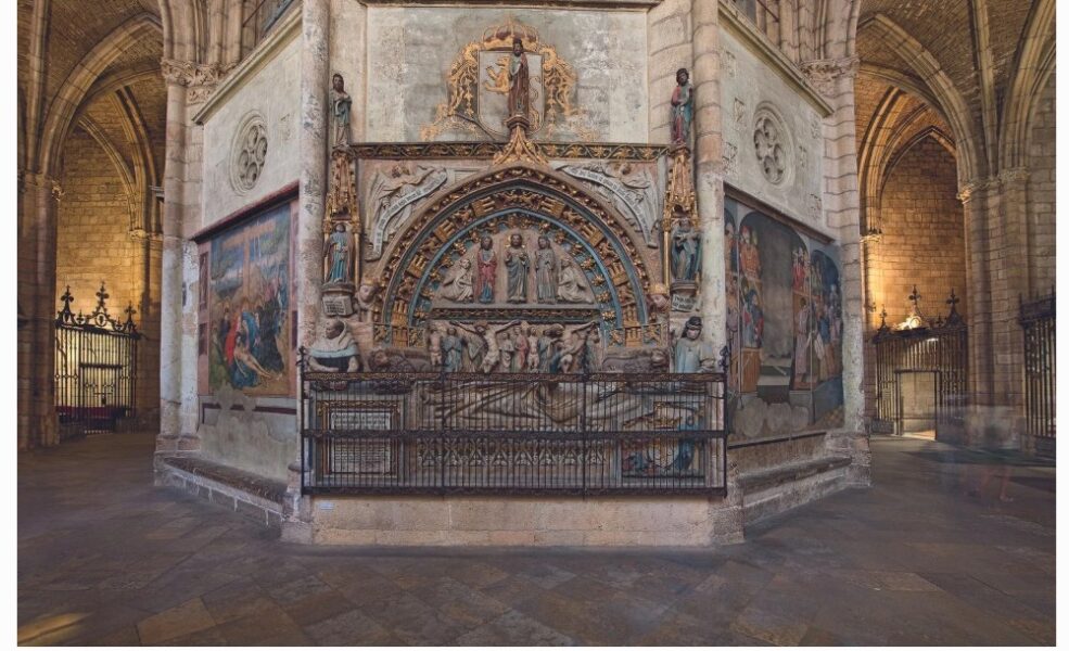 Elaborate tomb with effigy behind railings