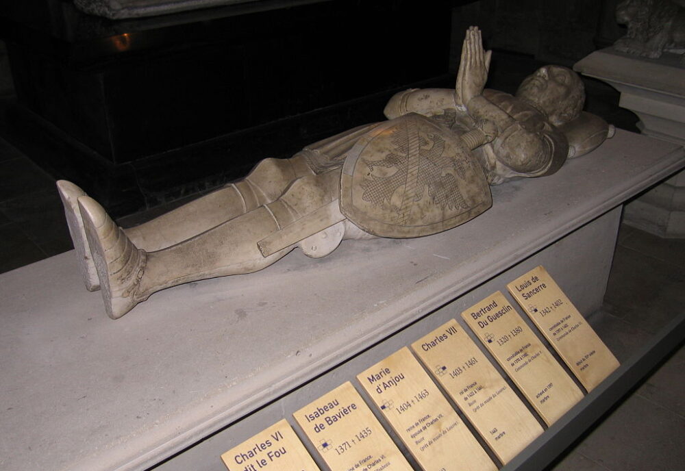 Effigy of man in late C14 armour, on a modern plinth