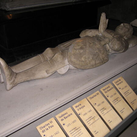 Effigy of man in late C14 armour, on a modern plinth