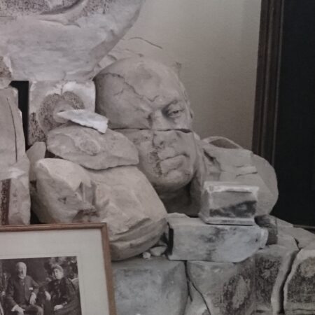 Head and fragments from the ruined monument