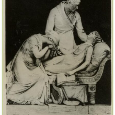 Tomb with carving of dying woman on a couch, mother weeps at feet, father bends over her