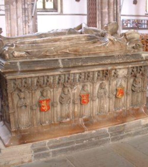 Chest tomb with double effigy. Angels and weeper figures on sode panels.